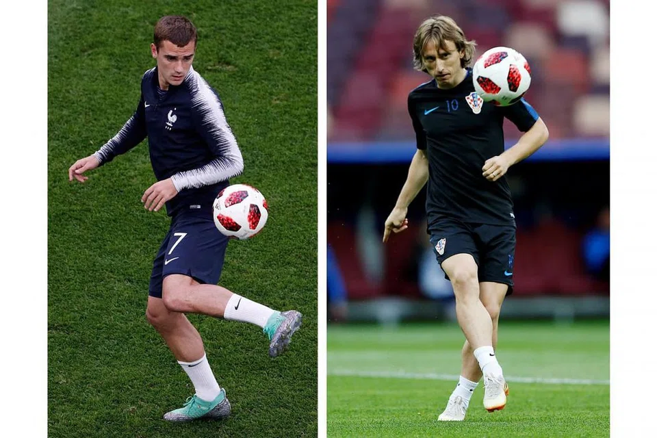 TUNGGAK KEKUATAN: Antoine Griezmann (kiri) dan Luka Modric (kanan) merupakan tunggak kekuatan Perancis dan Croatia. - Foto AFP