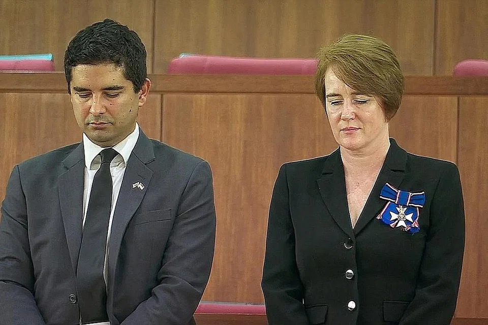 BERTAFAKUR: Pesuruhjaya Tinggi Britain ke Singapura, Cik Kara Owen, dan timbalan beliau, Encik Alex Bamford, di galeri awam di Parlimen semalam. - Foto MCI