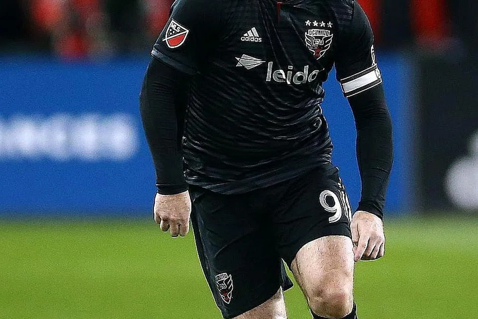 PEMAIN TUNGGAK: Wayne Rooney dianggap sebagai pemain penting yang menyumbang besar kepada DC United semasa bermain di Amerika Syarikat. - Foto AFP