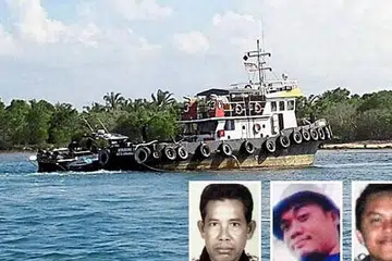 BOT TANPA PENGEMUDI: Bot pukat tunda Malaysia ditemui di perairan dekat Lahad Datu. Antara kru yang hilang (gambar sisipan dari kiri) ialah Encik Abdul Rahim Summas, Encik Fandy Bakran dan Mohammad Ridzuan Ismael. - Foto THE STAR