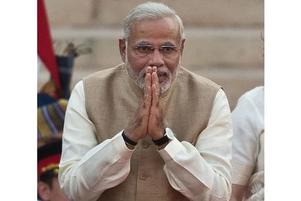 ENCIK MODI: Dapat jatuhkan Parti Kongres India dan keluarga Gandhi dengan menampilkan dirinya sebagai seorang rakyat biasa daripada keluarga susah tetapi mempunyai impian besar. - Foto AFP