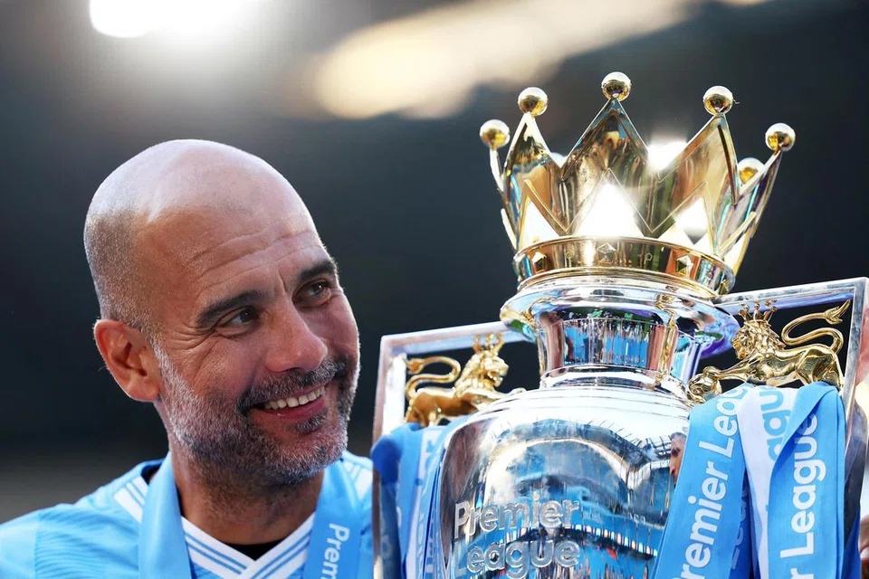 Pengurus Manchester City, Pep Guardiola, menyambut piala Liga Perdana England (EPL) keenamnya dalam lapan musim bersama City.    