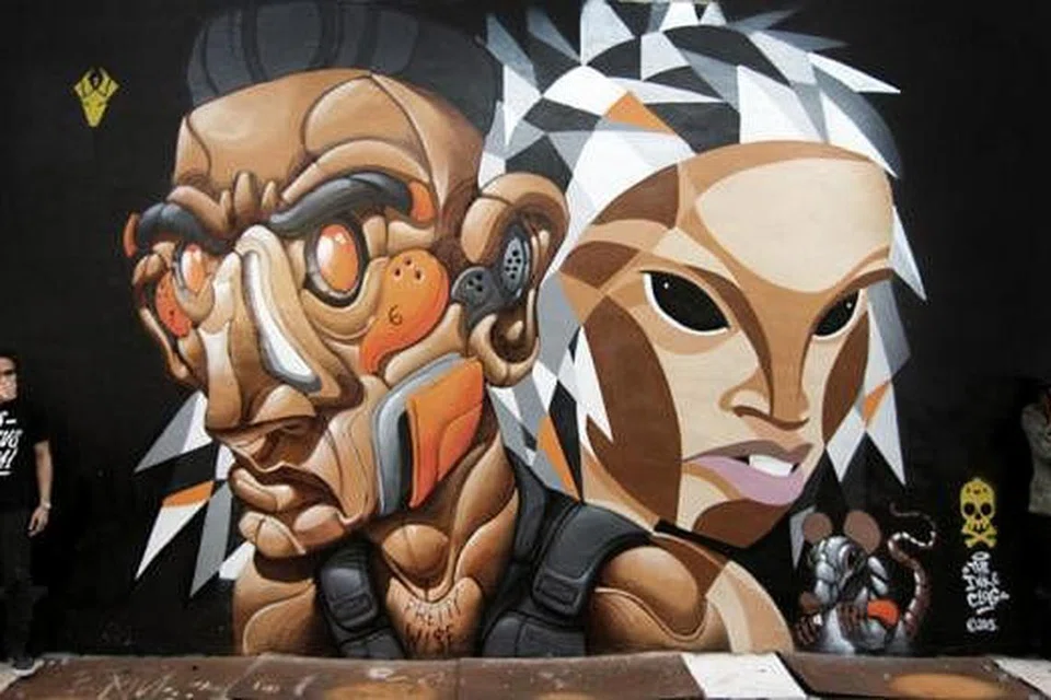 GABUNGAN DUA ARTIS GRAFITI: Encik Eman dan Cik Nadirah kerap mendapat undangan melukis tembok di pelbagai kota seperti Sydney, Melbourne, Osaka, London dan Perancis. - Foto INK & CLOG