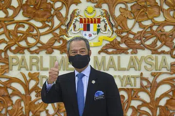 INGIN KEMBALIKAN MANDAT RAKYAT: Perdana Menteri Malaysia, Tan Sri Muhyiddin Yassin, memberi jaminan mandat rakyat akan dikembalikan untuk memilih kerajaan menerusi Pilihan Raya Umum sebaik sahaja pandemik Covid-19 berakhir di negara itu. - Foto EPA-EFE/ZARITH ZULKIFLI 