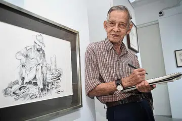 RAKAM SEJARAH SINGAPURA: Menerusi pameran solo Hitam Putih, Idris Ali, antara lain, mempamerkan lukisan yang menunjukkan warisan Singapura seperti tukang kasut berbangsa India yang beliau temui di jalanan dahulu.- Foto BH oleh KHALID BABA