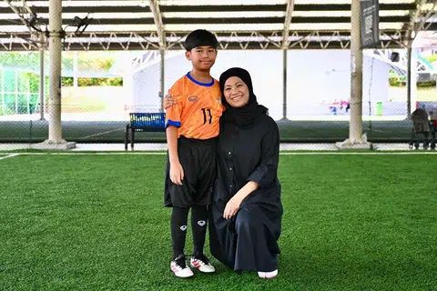 Cik Rosliani Roselan berasa teruja anaknya, Omar Khairudin, dapat menemui rakan baru dalam acara Piala Unity 2026.