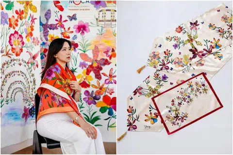 Skarf dan selendang meja dengan ilustrasi anggerik daripada mural, ‘Harmony In Bloom’, karya seni Phuay Li Ying, kini boleh digayakan.