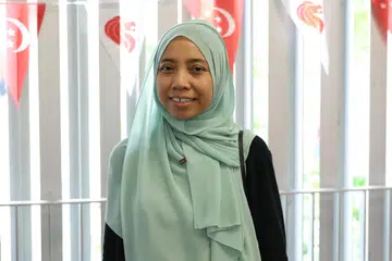 Cik Ade Halimah, 38 tahun, seorang pembantu rumah yang berasal dari Jawa Barat, Indonesia, merupakan salah seorang daripada 500 pembantu rumah migran (MDW) yang hadir pada acara Karnival Hari Kebangsaan di SowCare@Armenian di City Hall, pada 11 Ogos.