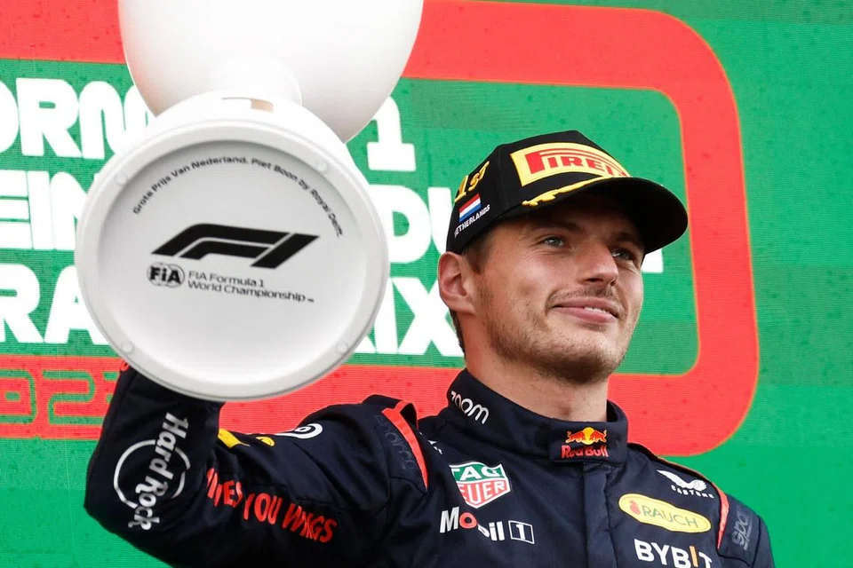 MENANG LAGI: Pemandu Red Bull, Max Verstappen, meraikan kemenangannya dalam perlumbaan Grand Prix Formula Satu Belanda dengan menjulang trofi beliau di The Circuit Zandvoort, di Belanda pada Ahad.