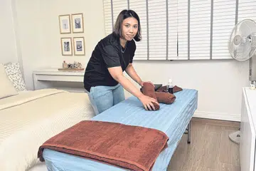 TUKANG URUT ADA 'SKILL': Cik Syafiqah Abdul Karim, 31 tahun, tergerak untuk mendalami bidang urut semasa mencari kursus yang sesuai untuk memanfaatkan Kredit SkillsFuture.