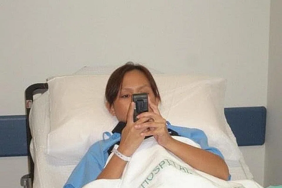 JALANI RAWATAN: Cik Sunarita semasa menjalani rawatan di Singapura.