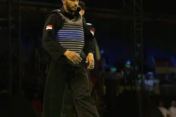 SUKAR TERIMA HAKIKAT: Reaksi Ferdous selepas kekalahannya dalam pusingan saringan acara tanding putera Kelas G (75-80kg) di Kejohanan Pencak Silat Dunia 2022 pada Selasa lalu. - Foto SIA KIAN TECK/PERSISI