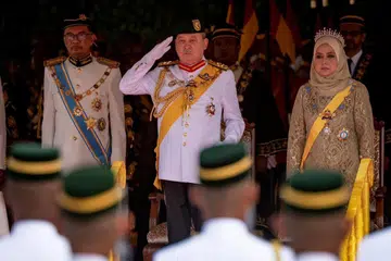 Yang di-Pertuan Agong Malaysia, Sultan Ibrahim Iskandar (tengah) bersama Raja Permaisuri Agong, Raja Zarith Sofiah, dan Perdana Menteri, Datuk Seri Anwar Ibrahim, ketika istiadat pembukaan persidangan Parlimen pertama untuk 2024 pada 26 Februari.