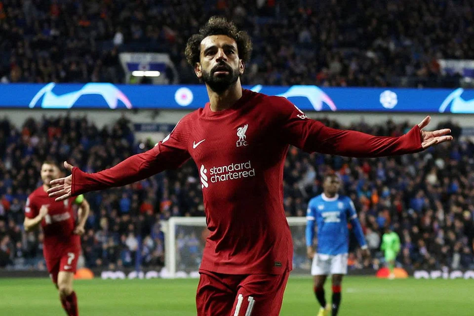 HATRIK SEPARUH MASA KEDUA: Bintang penyerang Liverpool, Mo Salah, meraikan salah satu dari tiga golnya selepas dimasukkan dalam babak kedua permainan menentang Rangers dinihari semalam. - Foto REUTERS