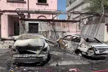 This screen grab taken from handout footage released by Bahrain TV on June 11, 2026, shows damage to buildings and vehicles in Bahrain reportedly caused by debris from intercepted drones. Iran warned on June 11 that the shaky ceasefire in the three-month Middle East war was now "practically meaningless" following fresh strikes by the United States that saw Tehran respond with attacks around the region. (Photo by Bahrain TV / AFP) / RESTRICTED TO EDITORIAL USE - MANDATORY CREDIT "AFP PHOTO / BAHRAIN TV" - HANDOUT - NO MARKETING NO ADVERTISING CAMPAIGNS - DISTRIBUTED AS A SERVICE TO CLIENTS