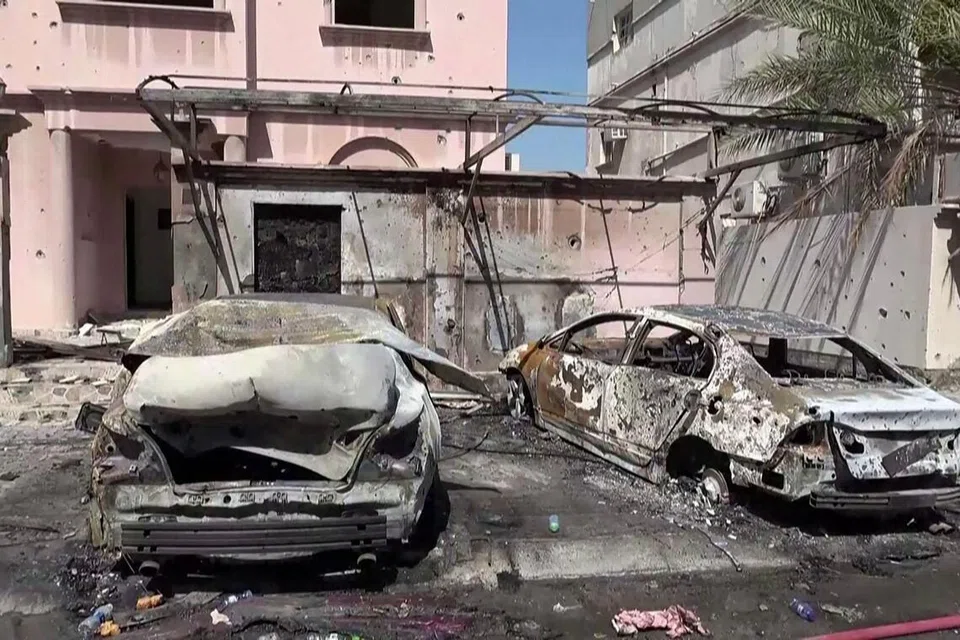 This screen grab taken from handout footage released by Bahrain TV on June 11, 2026, shows damage to buildings and vehicles in Bahrain reportedly caused by debris from intercepted drones. Iran warned on June 11 that the shaky ceasefire in the three-month Middle East war was now "practically meaningless" following fresh strikes by the United States that saw Tehran respond with attacks around the region. (Photo by Bahrain TV / AFP) / RESTRICTED TO EDITORIAL USE - MANDATORY CREDIT "AFP PHOTO / BAHRAIN TV" - HANDOUT - NO MARKETING NO ADVERTISING CAMPAIGNS - DISTRIBUTED AS A SERVICE TO CLIENTS