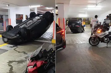 SIASATAN SEDANG DIJALANKAN: Sebuah kereta hitam dipercayai terbabas lalu terbalik di sebuah tempat letak kereta bertingkat di Woodlands pada petang 2 Jun.