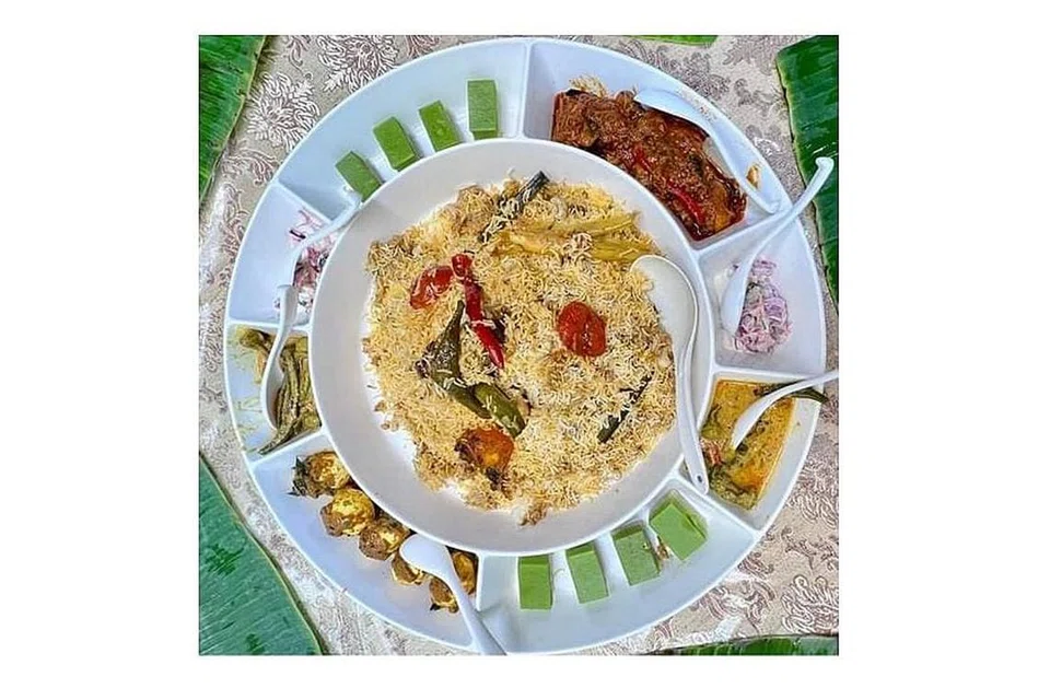 Gambar atas ialah sajian beriani dam yang disediakan syarikatnya. - Foto-foto HAR YASIN RESTAURANT PTE LTD.