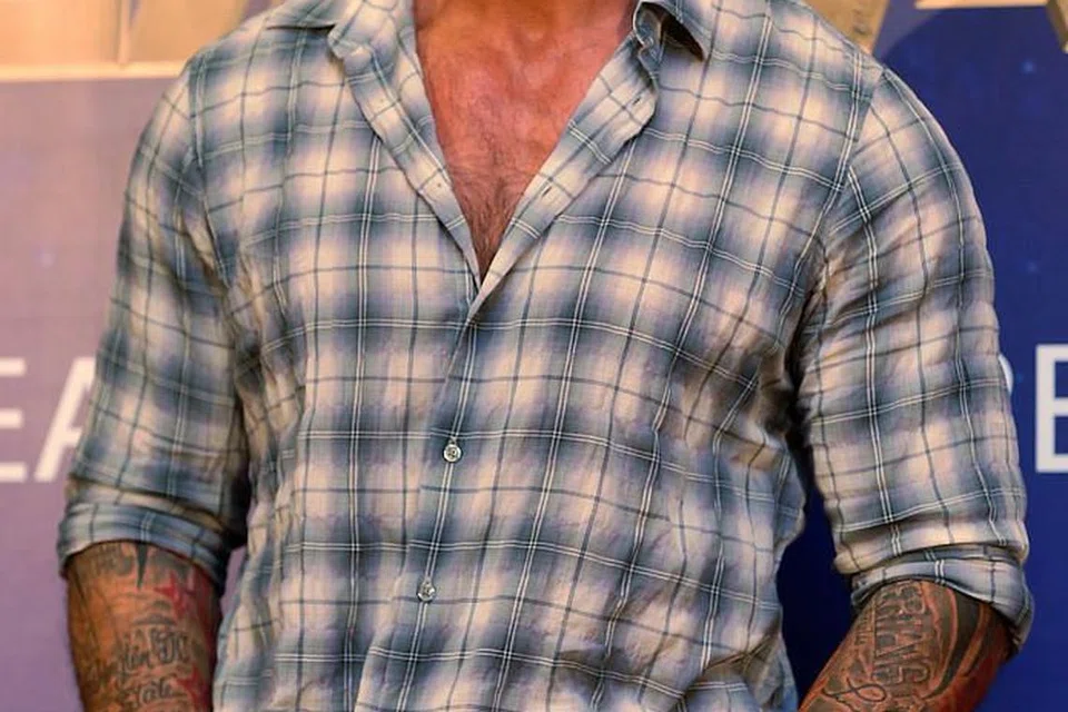 SEMAKIN LAKU: Jika dahulu Dave Bautista digeruni semasa bertarung dalam gelanggang gusti, kini namanya populan dalam dunia perfileman. - Foto fail THE STRAITS TIMES