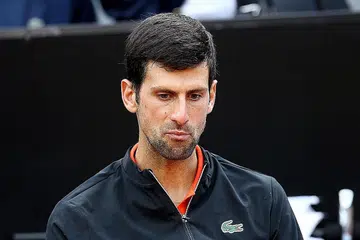 Djokovic, atas - Foto AFP