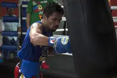 MANNY PACQUIAO: Petinju dari Filipina ini mengesahkan akan menentang Amir Khan pada 23 April atas saranan peminat. - Foto AFP