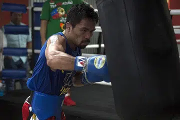 MANNY PACQUIAO: Petinju dari Filipina ini mengesahkan akan menentang Amir Khan pada 23 April atas saranan peminat. - Foto AFP