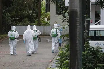 JALANI PEMBERSIHAN: Rumah Dewasa Kurang Upaya MINDSville di Hougang menjalani kerja pembersihan dan nyahjangkitan, setelah 27 kes Covid-19 disahkan di rumah tersebut. - Foto BH oleh TIMOTHY DAVID