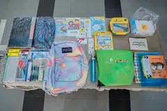 TERIMA BANTUAN: Antara barang keperluan sekolah yang diberi kepada pelajar memerlukan di Pasir Ris termasuk beg, buku nota, fail, pen dan baucar Bata bernilai $30. 
