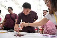 Menteri Pembangunan Negara Encik Chee Hong Tat, menyertai sama permainan di acara masyarakat PA Family PLAYGround 2025 di Kelab Masyarakat Toa Payoh West pada 21 Jun.