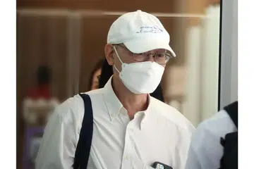 MENGAKU SALAH: Jimmy Liu (atas) mengaku bersalah terhadap tiga tuduhan di bawah Akta Taman dan Pokok serta satu tuduhan di bawah Akta Kehidupan Liar. Dia merupakan antara empat pegawai JTC Corporation dan CPG Consultants yang terlibat dalam kerja pembangunan Taman Inovasi Pertanian-Makanan (AFIP) Kranji. - Foto BH oleh KELVIN CHNG, fail