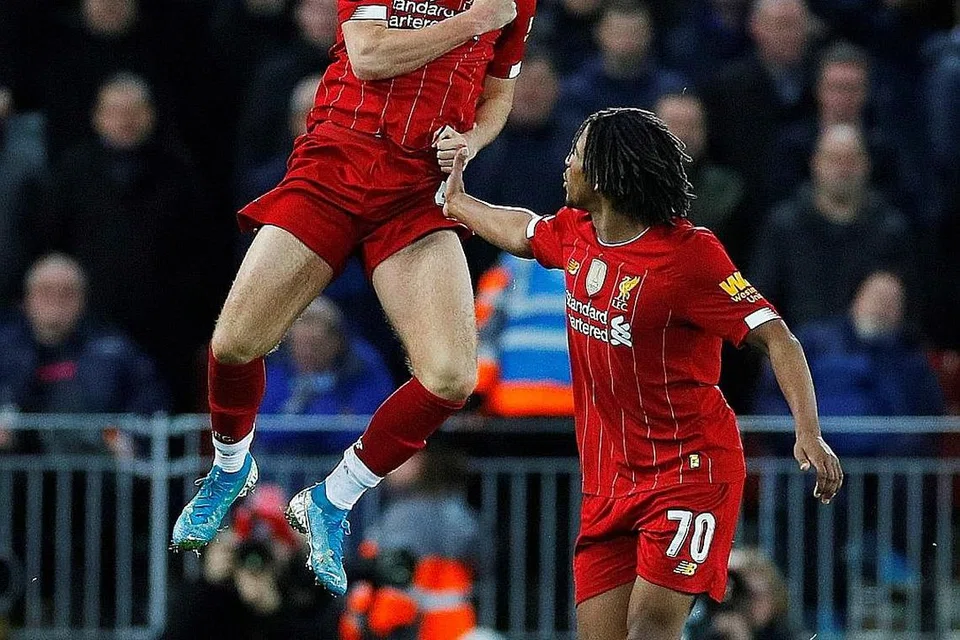 GOL SULUNG: Curtis Jones (kiri) meraikan gol senior pertamanya untuk Liverpool bersama rakan sepasukan Yasser Larouci. - Foto REUTERS