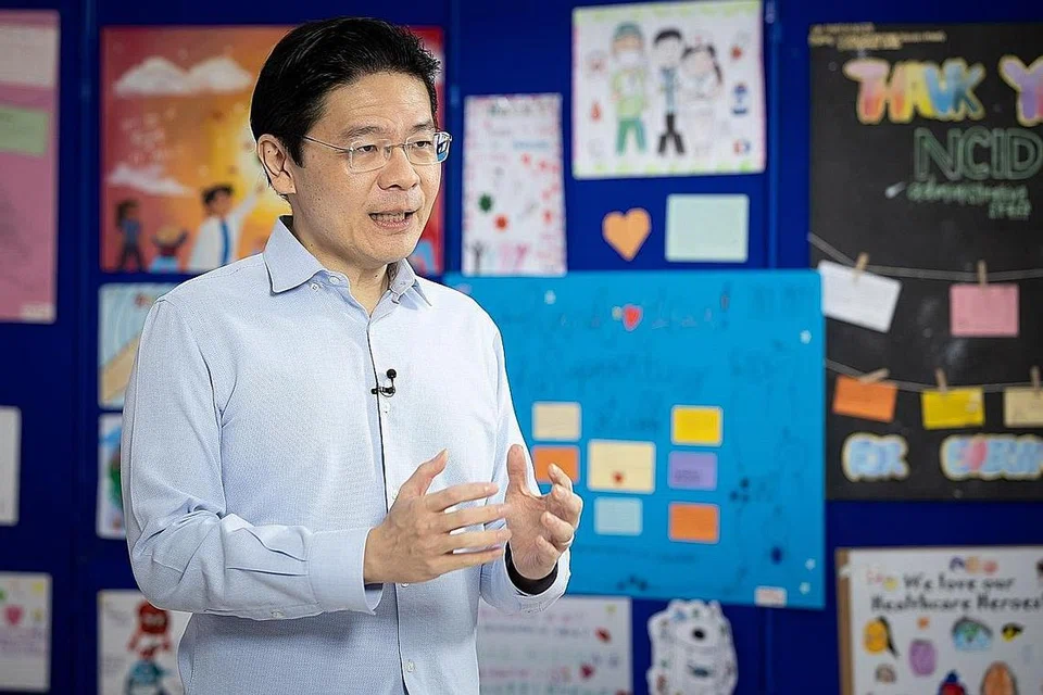 SIARAN NASIONAL: Menteri Pembangunan Negara, Encik Lawrence Wong berucap di Pusat Nasional Bagi Penyakit Berjangkit (NCID), sebahagian daripada siri siaran nasional yang disampaikan pemimpin negara. - Foto MCI