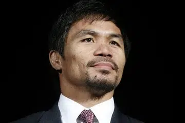 SEORANG DERMAWAN: Manny 'Pac-Man' Pacquiao dijangka mendermakan separuh daripada AS$100 juta pendapatan yang diraih daripada perlawanan tinju dengan Floyd 'Money' Mayweather Jr, di Las Vegas, pada Sabtu lalu. Foto REUTERS.