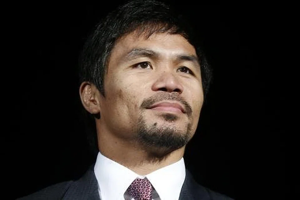 SEORANG DERMAWAN: Manny 'Pac-Man' Pacquiao dijangka mendermakan separuh daripada AS$100 juta pendapatan yang diraih daripada perlawanan tinju dengan Floyd 'Money' Mayweather Jr, di Las Vegas, pada Sabtu lalu. Foto REUTERS.