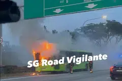 KEBAKARAN BAS: Foto yang dimuat naik di media sosial menunjukkan anggota bomba memadamkan kebakaran di bahagian belakang sebuah bas yang berhenti di tepi jalan.