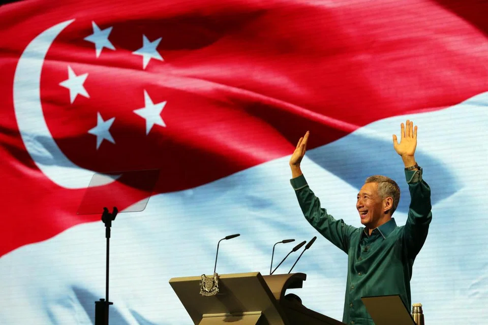 Perdana Menteri, Encik Lee Hsien Loong, melambai kepada hadirin selepas berucap di Rapat Hari Kebangsaan di Institut Pendidikan Teknikal (ITE) Kolej Central pada 17 Ogos 2014.
