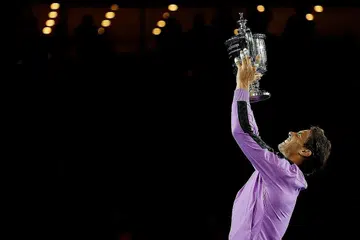 KEMENANGAN BESAR: Nadal meraikan kejayaannya selepas berjaya mengatasi Medvedev untuk memenangi gelaran Grand Slam ke-19 bagi dirinya dalam aksi final Terbuka Amerika Syarikat, semalam. - Foto REUTERS