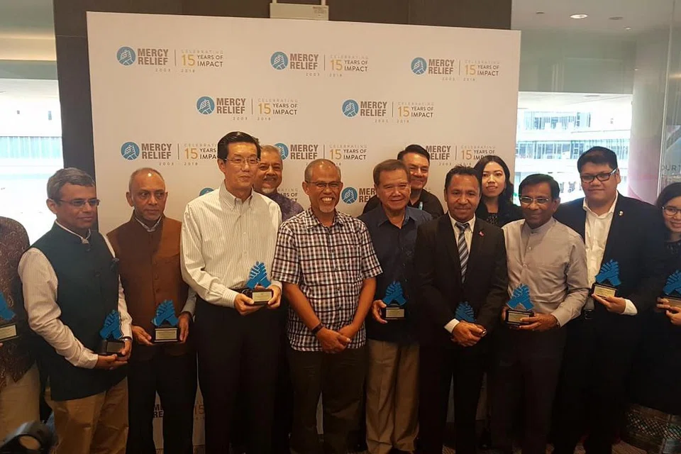 ULANG TAHUN MERCY RELIEF: Encik Masagos bersama hadirin di acara sempena ulang tahun ke-15 Mercy Relief di Our Tampines Hub pada 22 September 2018.