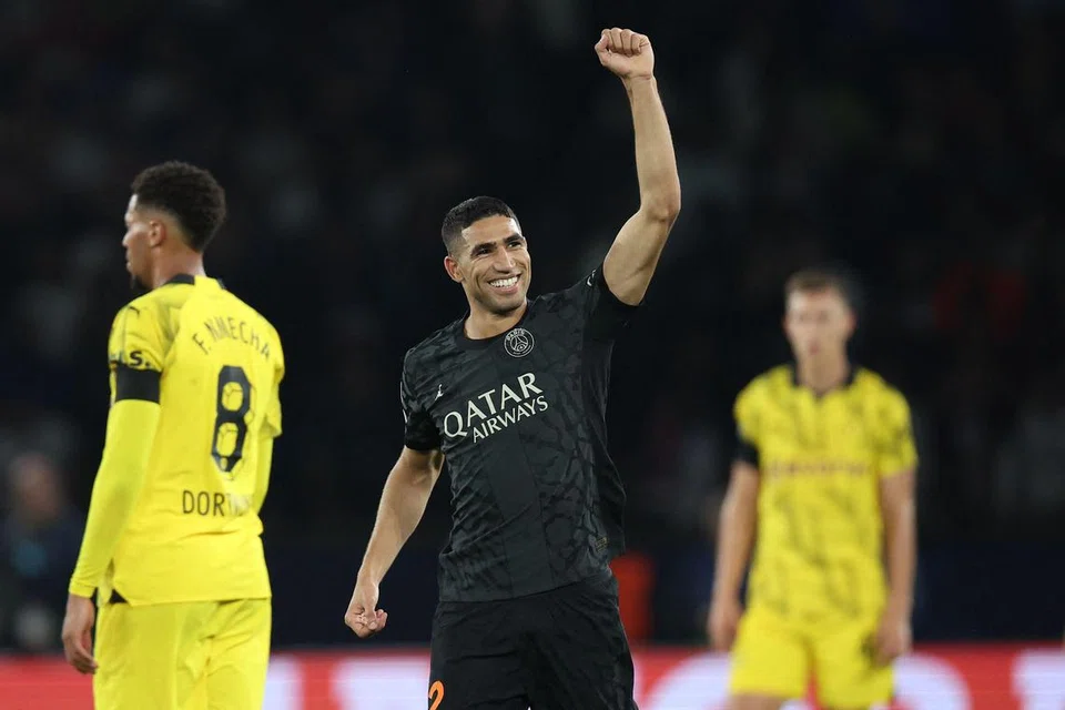 RAI GOL: Pemain bek kanan Achraf Hakimi meraikan jaringannya yang membantu PSG mendapatkan gol kedua dalam perlawanan pembukaan Kumpulan F Liga Juara-Juara menentang Dortmund.