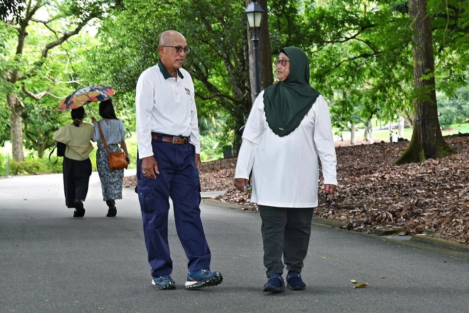 Tugas Encik Ali Jasman (kiri) dan Cik Rasidah Zali termasuk meronda kawasan Kebun Bunga Singapura yang luas itu dan memastikan kawasan itu kekal selamat, bersih dan indah untuk kegunaan orang awam.