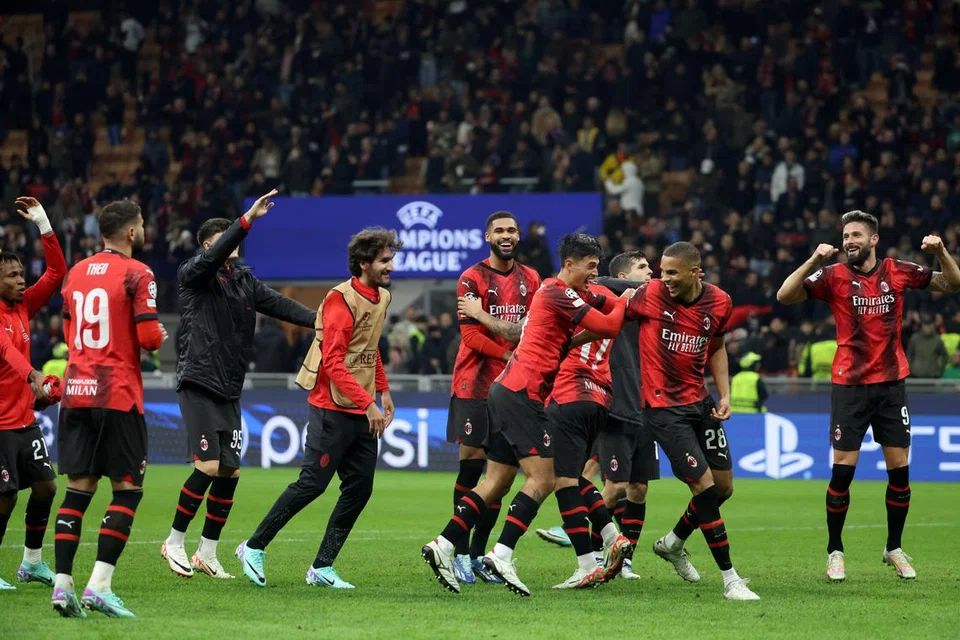 GEMBIRA: Pemain AC Milan bergembira selepas mengalahkan Paris St-Germain 2-1 pada Rabu.