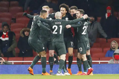 TERUS CEMERLANG: Para pemain City meraikan gol ketiga jaringan Leroy Sane (tengah) semasa menewaskan Arsenal dalam satu perlawanan Liga Perdana dinihari semalam. - Foto AFP