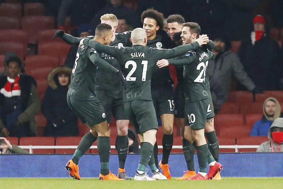 TERUS CEMERLANG: Para pemain City meraikan gol ketiga jaringan Leroy Sane (tengah) semasa menewaskan Arsenal dalam satu perlawanan Liga Perdana dinihari semalam. - Foto AFP
