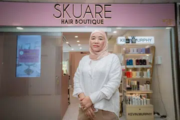 Cik Rudzaidah Darsurnik, yang lebih mesra dengan panggilan Zaidah, di hadapan Skuare Hair Boutique di tingkat lima Far East Plaza di Scotts Road.