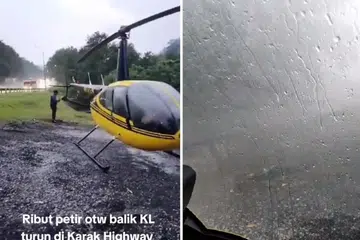 DEK CUACA: Seorang juruterbang terpaksa mendaratkan helikopternya di tepi lebuh raya Karak sekitar 5 petang, 9 Oktober 2023.