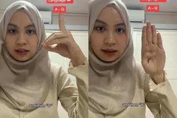 Cik Nur Aida Poh Muhammad Aizat Poh memanfaatkan wadah TikTok untuk mengajar asas Bahasa Isyarat Singapura (SgSL) kepada masyarakat umum.