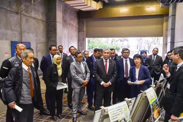Timbalan Perdana Menteri Malaysia, Datuk Seri Dr Ahmad Zahid Hamidi (depan, tiga dari kanan) bersama ahli delegasi mendengar taklimat yang disampaikan pihak berkuasa Jepun sempena lawatan kerja ke negara itu pada 21 Februari.