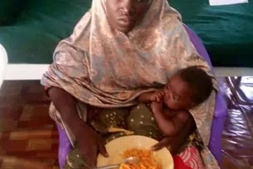 Gambar tidak bertarikh pelajar Chibok yang diselamatkan bersama bayinya yang dikeluarkan pada Rabu (18 Mei) oleh tentera Nigeria. 