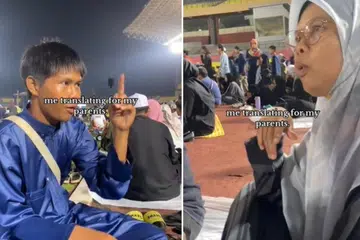 Muhammad Nabil Mohd Nazrol, 17 tahun kelihatan menterjemahkan satu ceramah agama di Stadium Hang Jebat, di Melaka kepada bahasa isyarat untuk ibu bapanya yang bisu dan pekak.