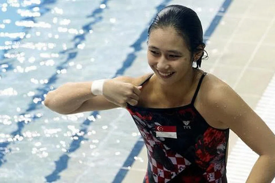 GEMBIRA MENANG PINGAT: Fong Kay Yian terperanjat dapat menyumbangkan pingat gangsa kepada negara melalui acara terjun indah 3 meter papan anjal semalam. - FOTO SSOC/REUTERS